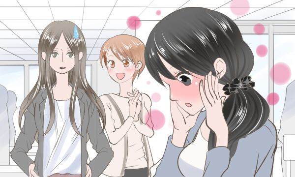 社員食堂で照れる女性