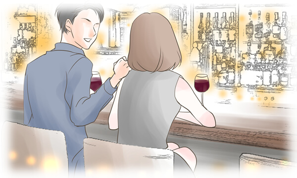 バーでワインを飲む男女